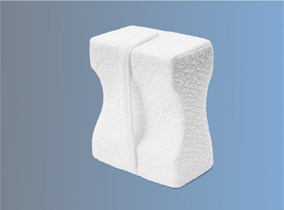 The Helix Side Sleeper Knee Pillow on a blue background