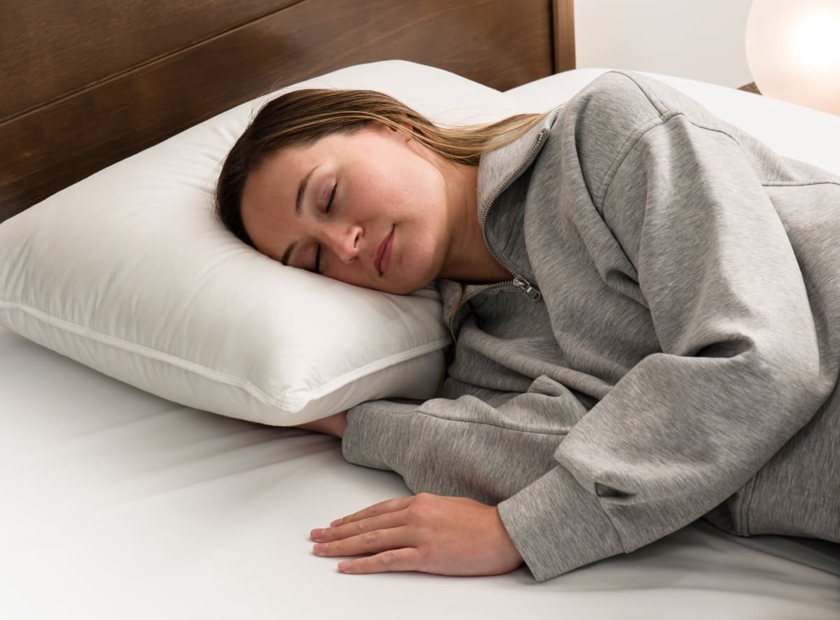 The Down and Feather pillow in a bedroom scene with a side sleeper