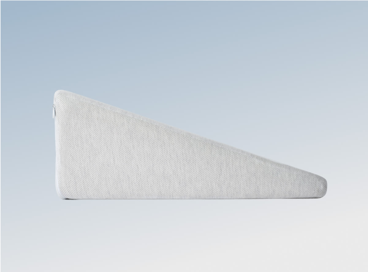 The Helix Wedge Pillow on a blue gradient background