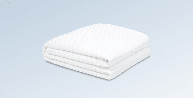 An image of the GlacioTex Cooling Mattress Protector on a light blue gradient background