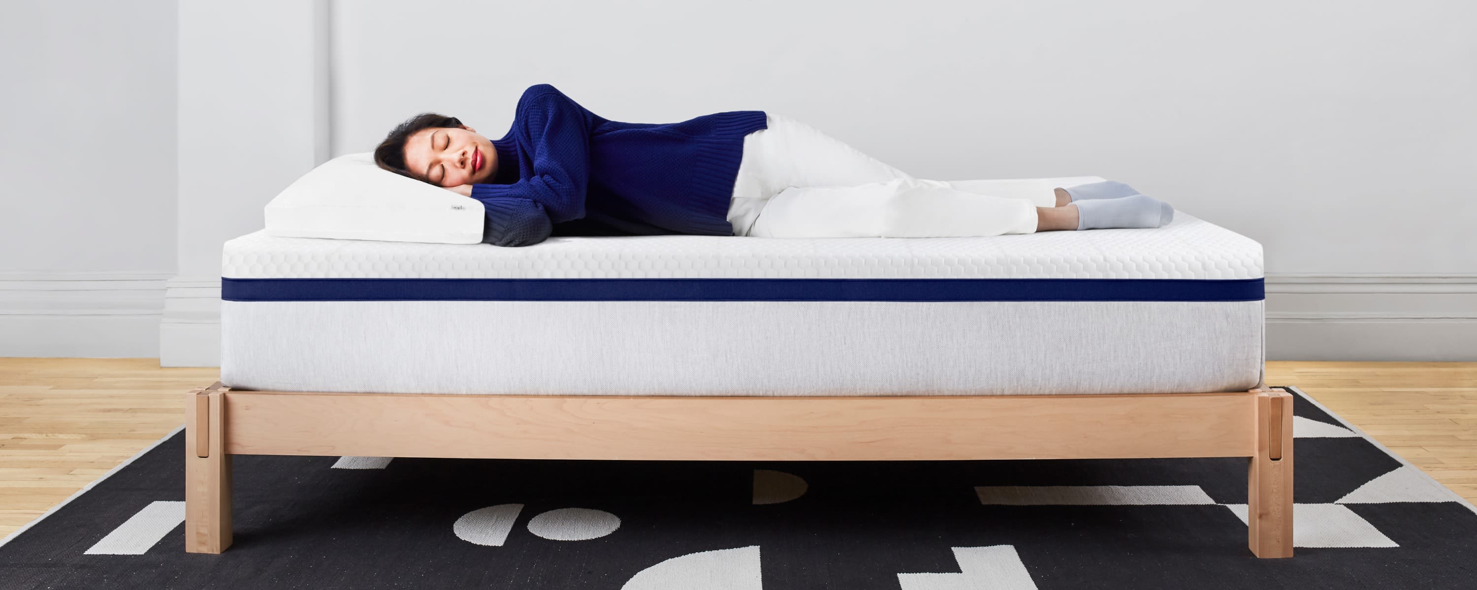 Woman Sleeping on Helix Midnight Mattress