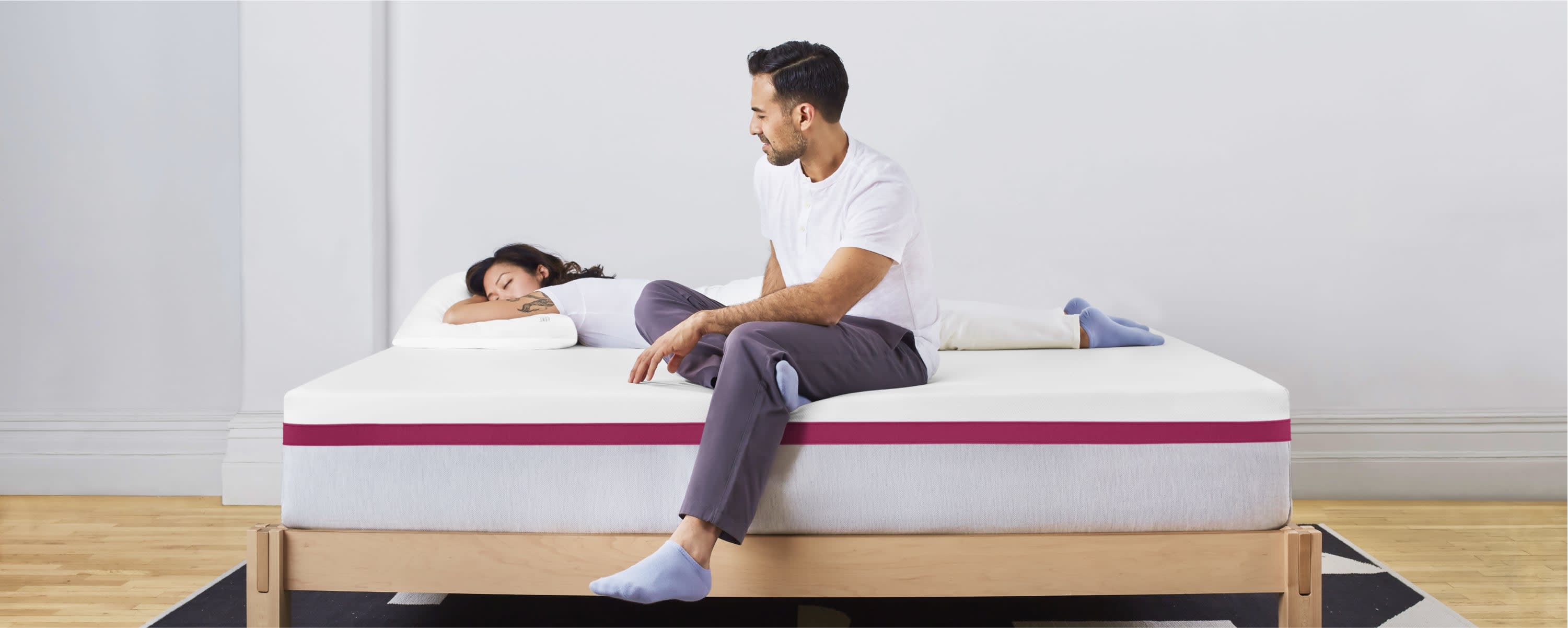 Two people on a Helix Dusk mattress