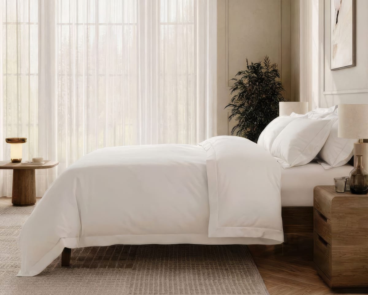 An image of the Duvet Cover and Duvet Insert laid across a bed in a bedroom scene