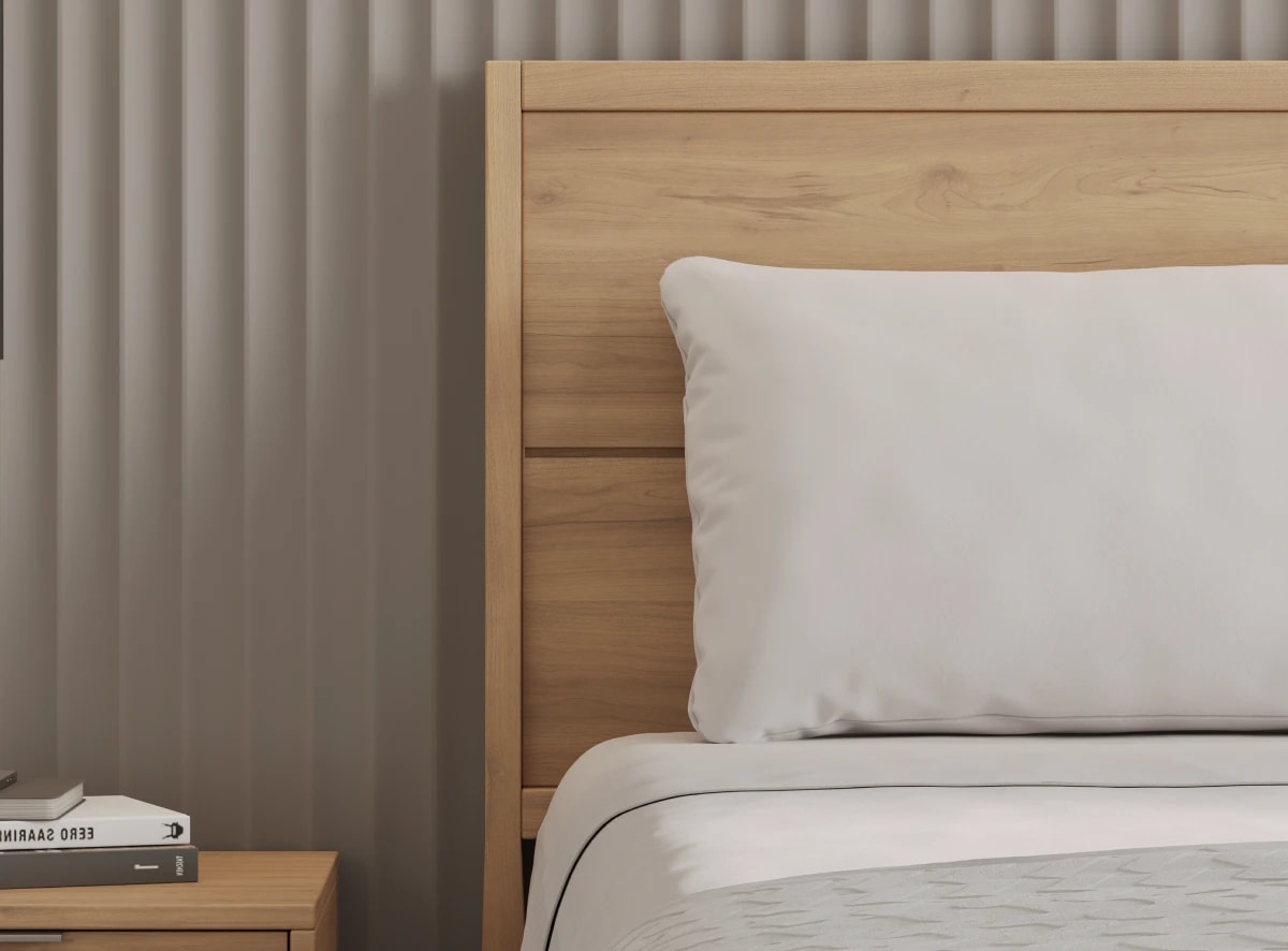 A rendered image of the Ludlow Bed Frame in a bedroom scene