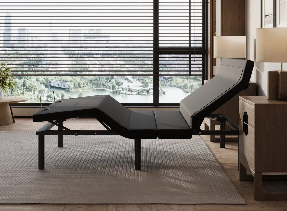 A rendered image showing the Elite Adjustable Base in a bedroom scene shows its head and foot adjustability