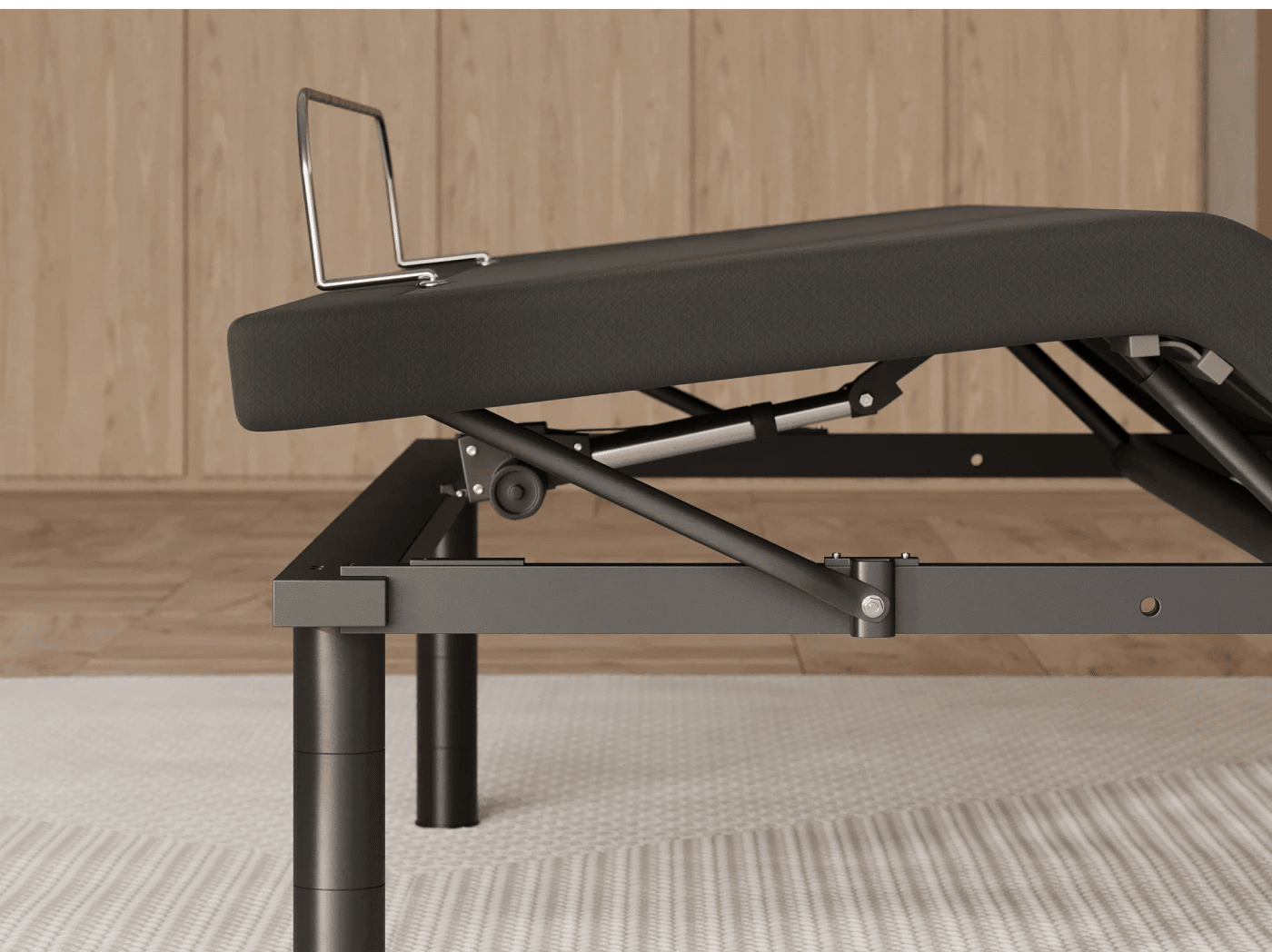 A closeup of the Elite Adjustable Base showing its foot elevation and retainer bar