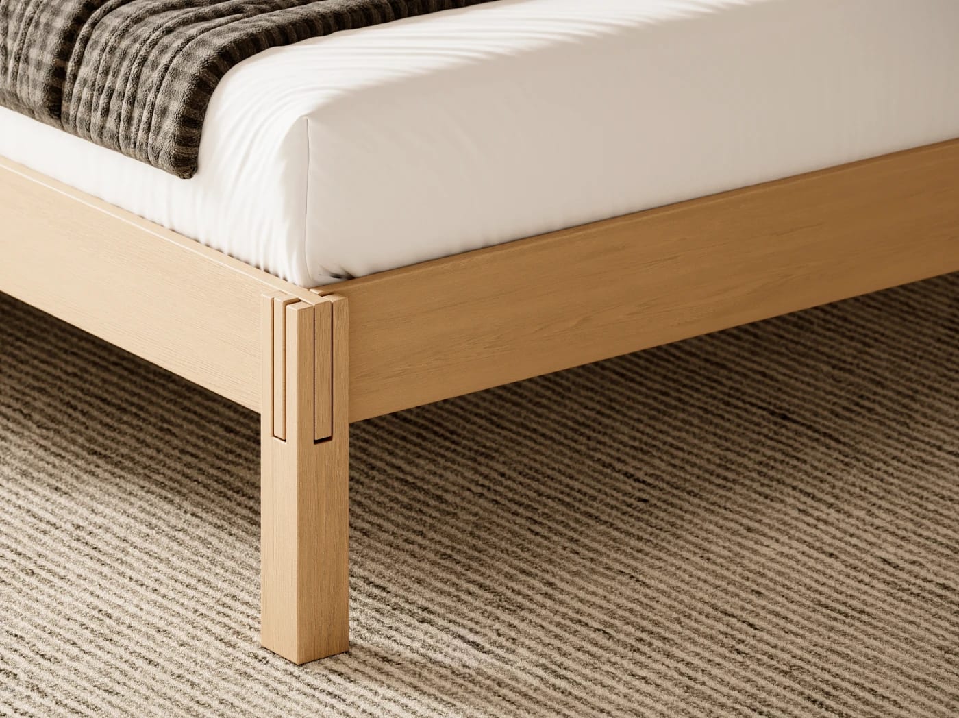 A closeup image of the Madison Bed Frame in white