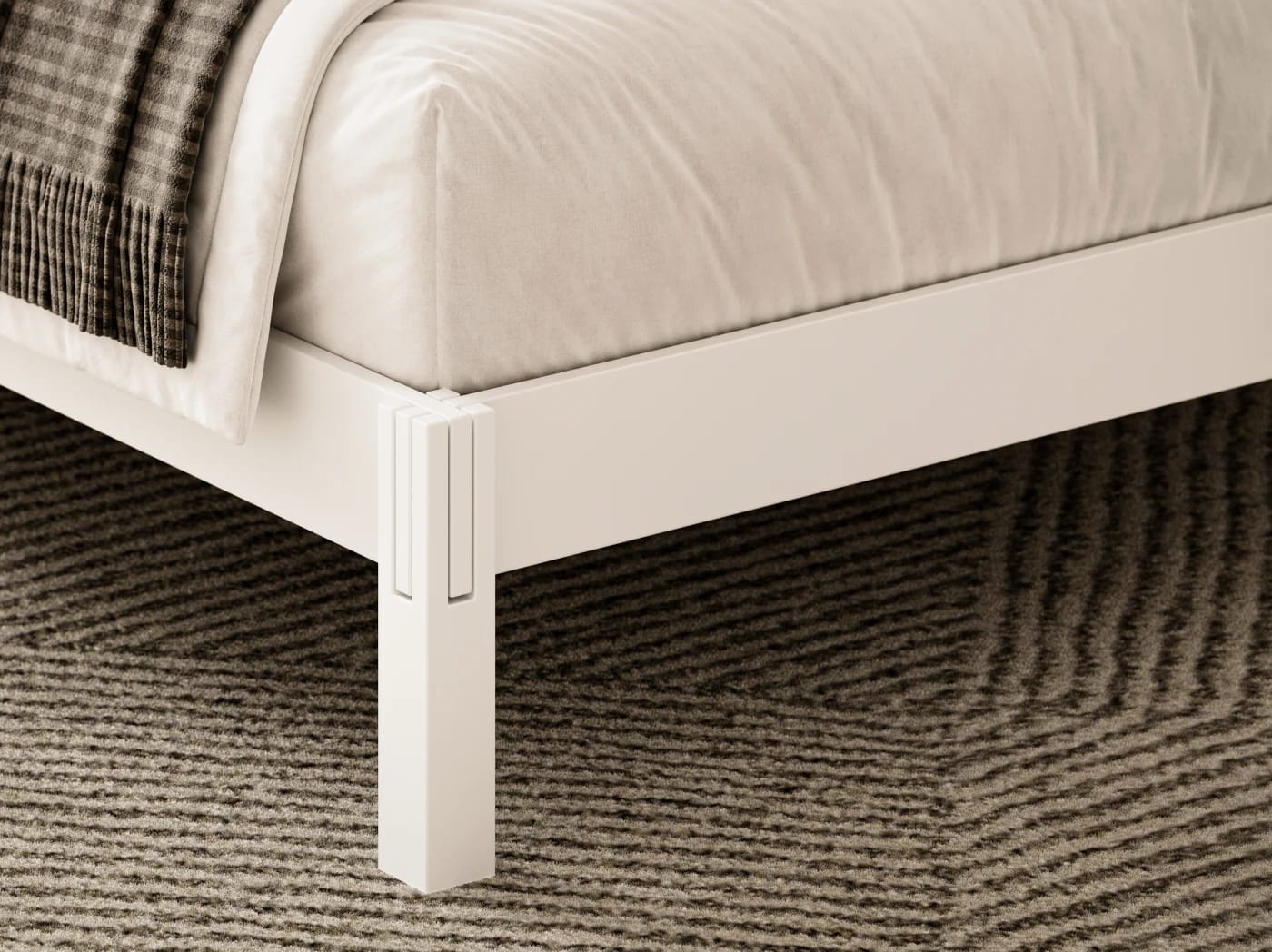 A closeup image of the Madison Bed Frame in white