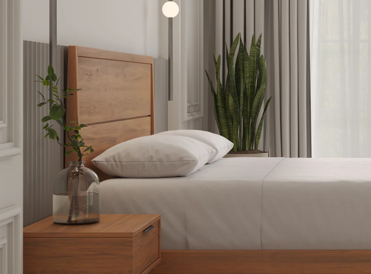 A rendered image of the Ludlow Bed Frame in a bedroom scene