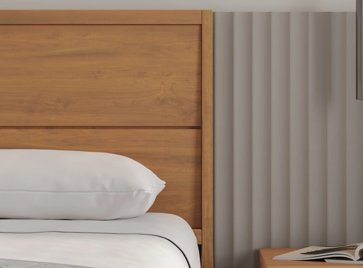 A rendered image of the Ludlow Bed Frame in a bedroom scene