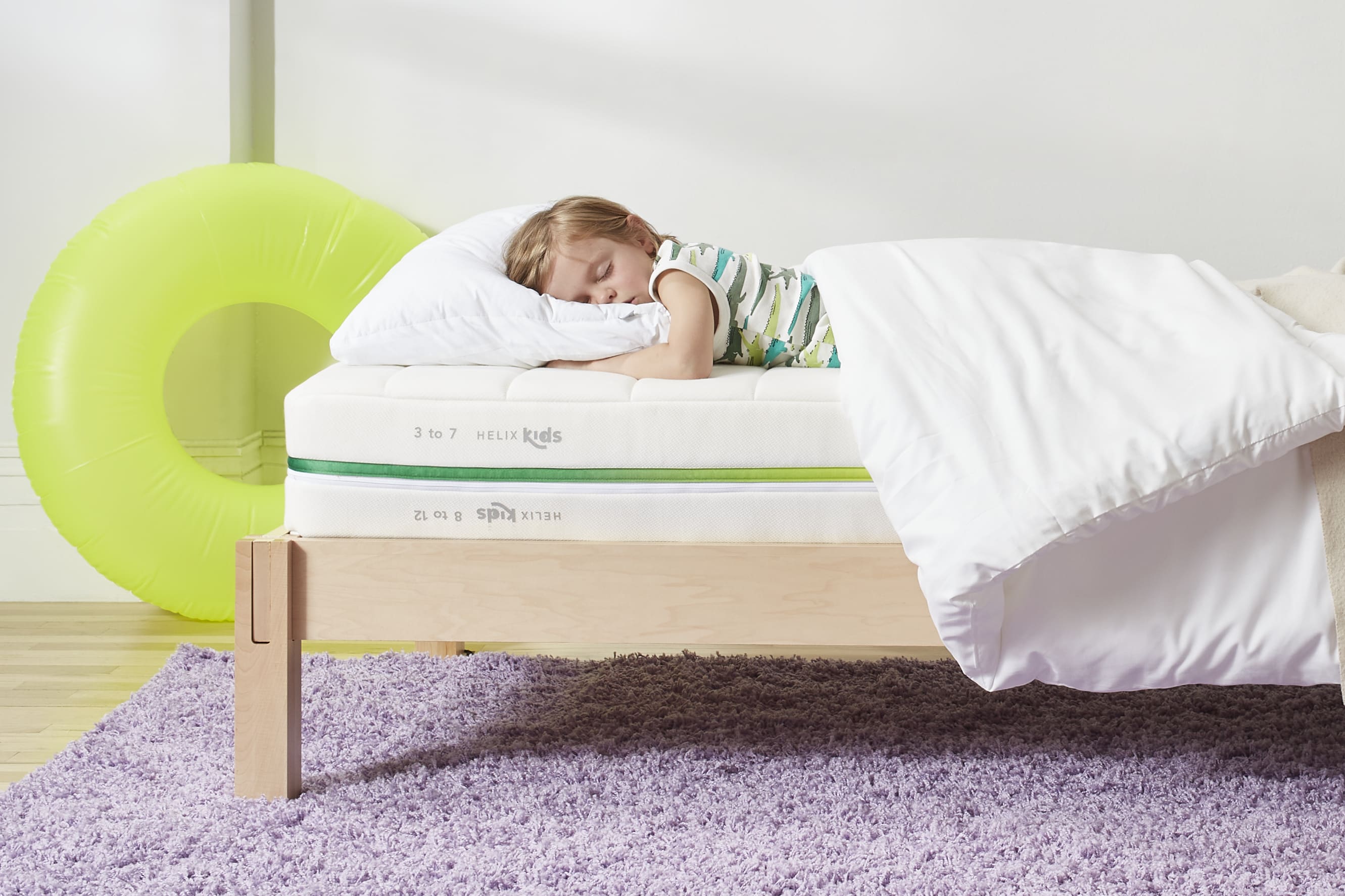 Young boy sleeping on Helix Kids mattress
