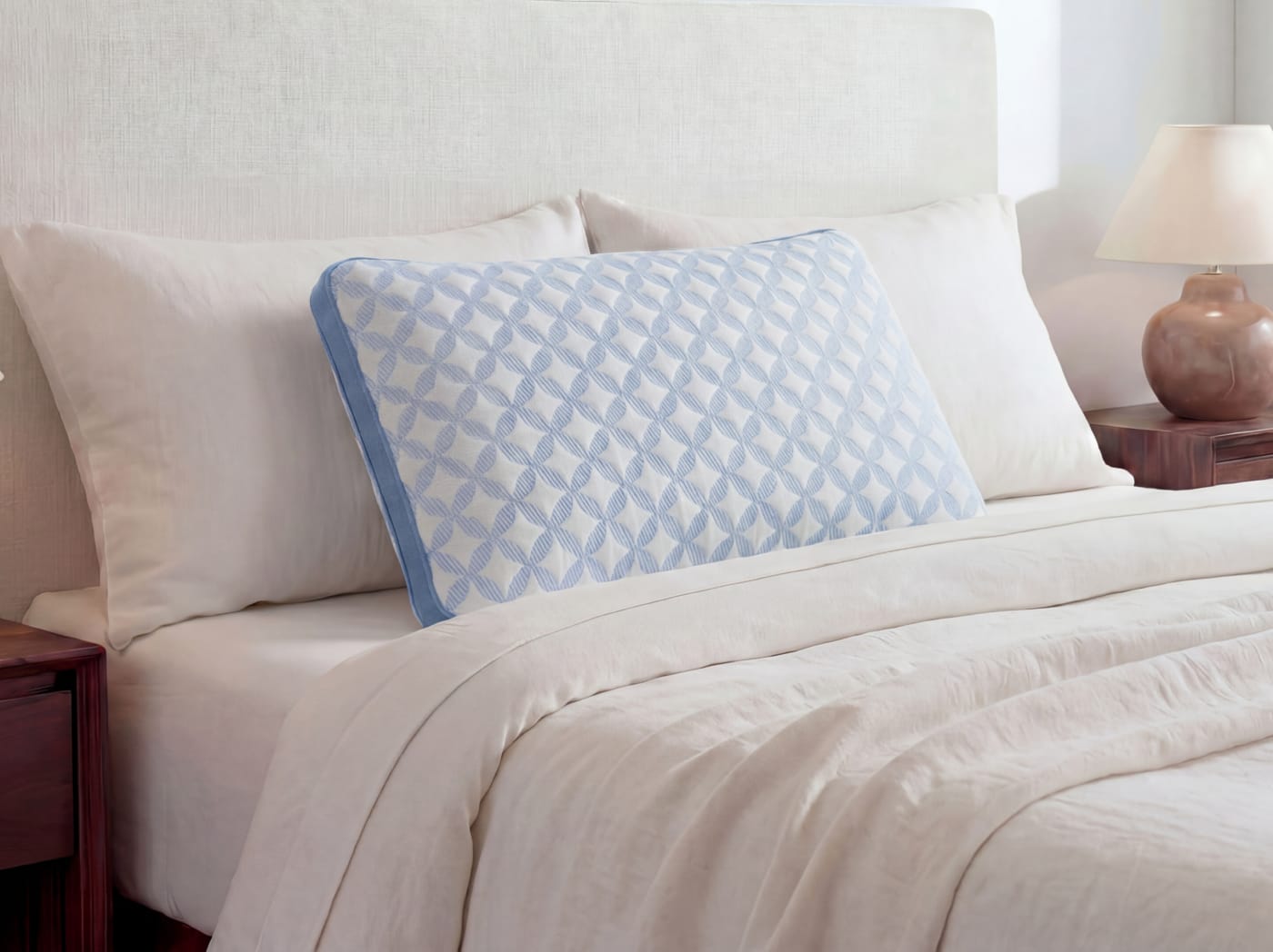 A closeup of the Cooling Memory Foam Pillow on a bed