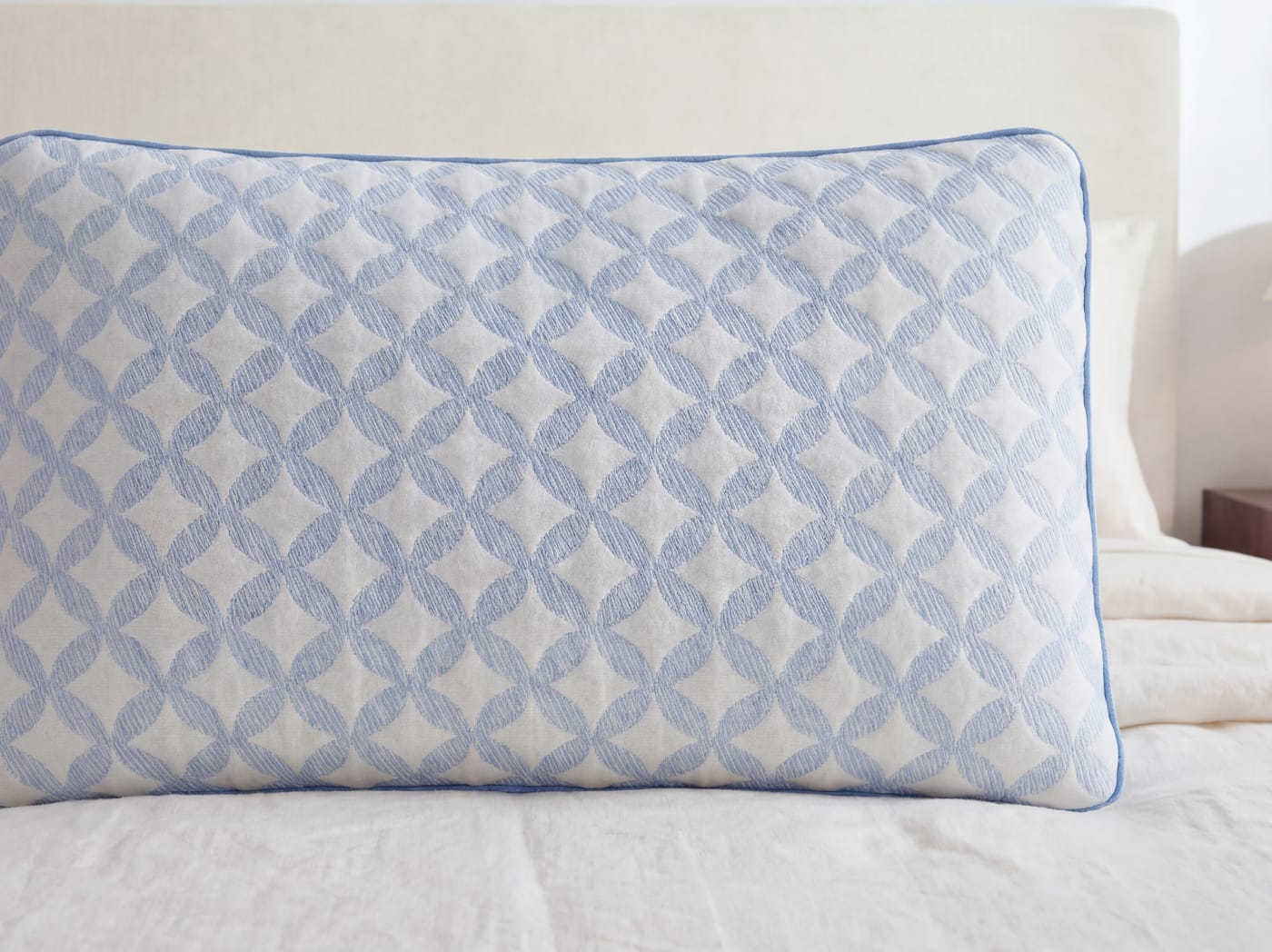 A closeup of the Cooling Memory Foam Pillow on a bed