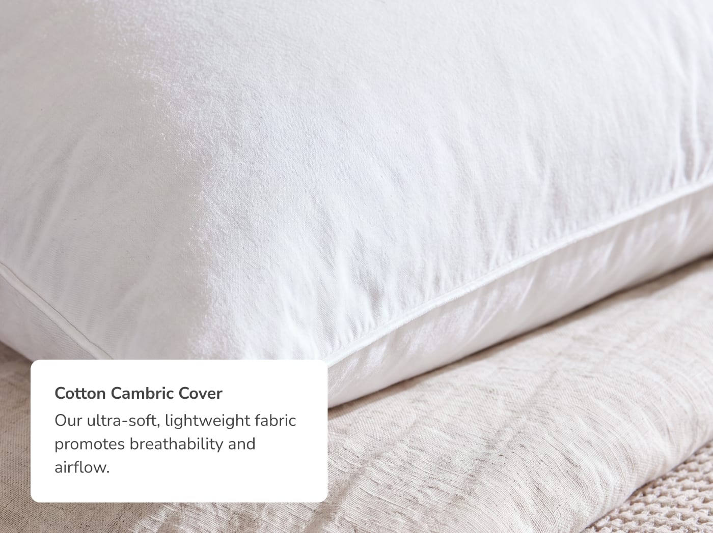 A close up of the Down and Feather pillow with a callout to its cotton cover