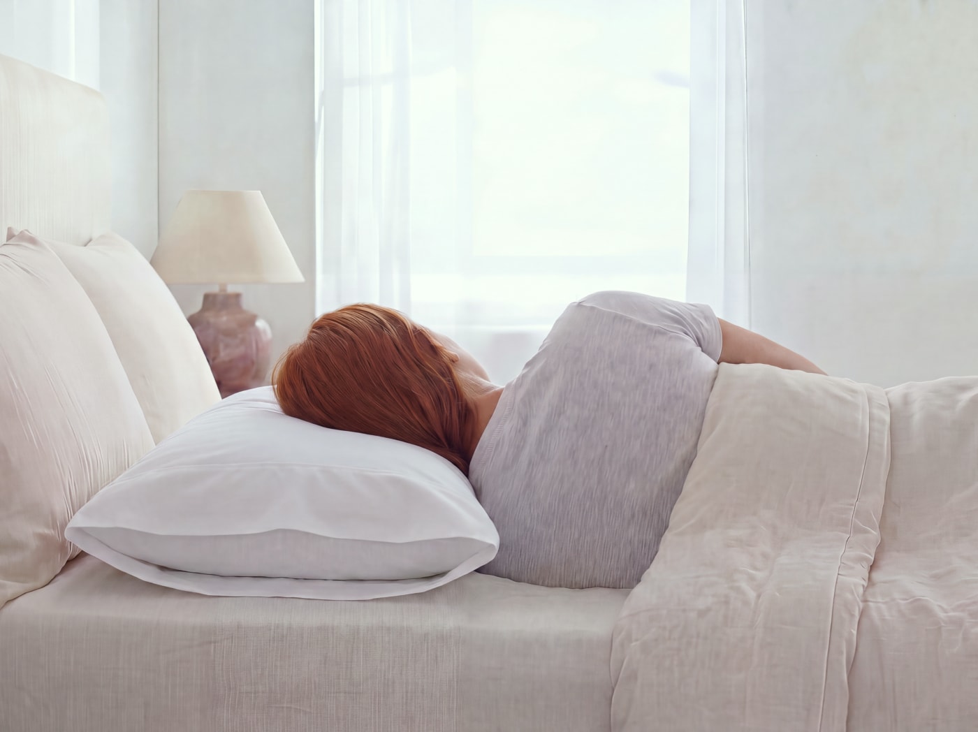 A woman sleeping on a Dream Pillow