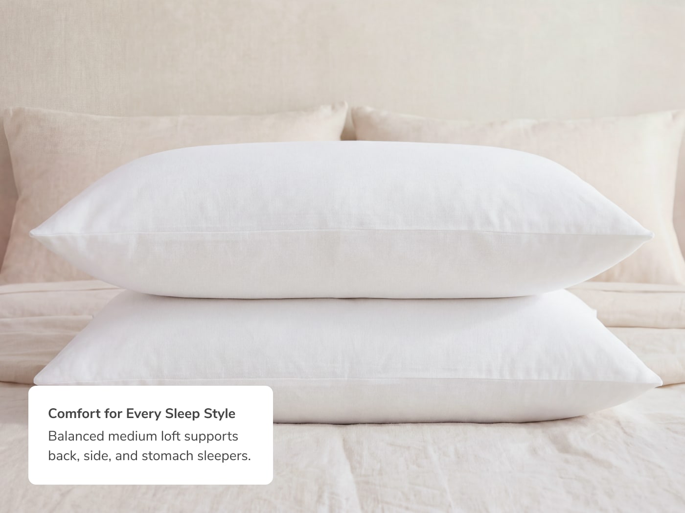 Two Dream Pillows stacked with a callout to their comfort for every sleep style
