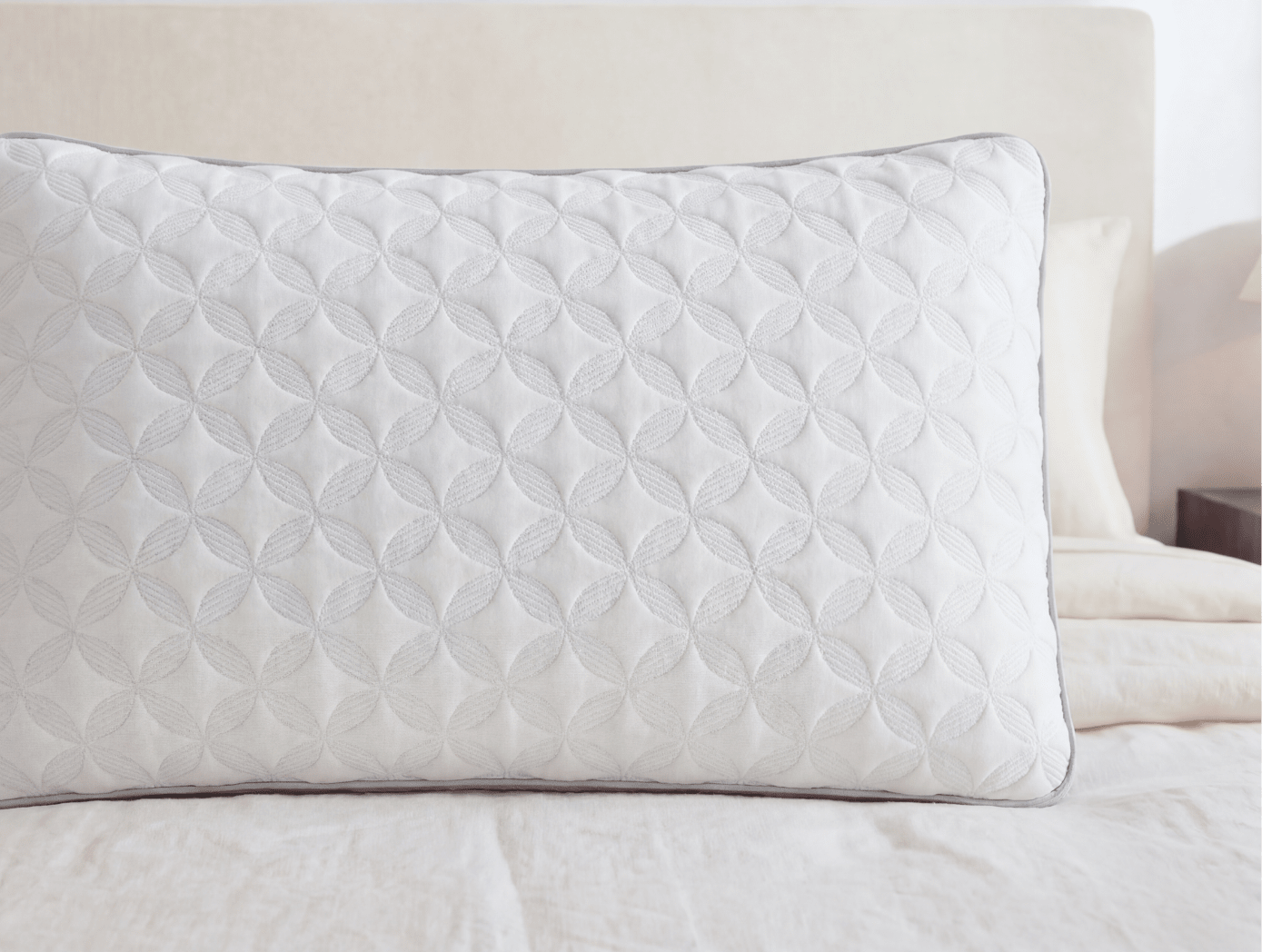 A closeup of the Talalay Latex Pillow on a bed