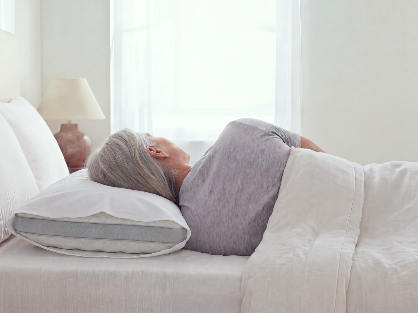 A woman sleeping on a Talalay Latex Pillow