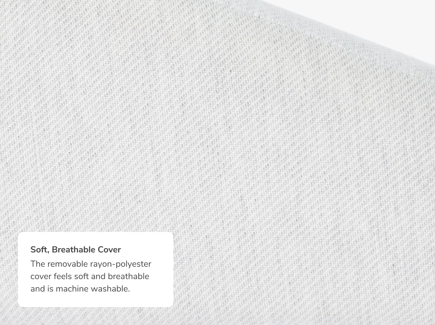 A closeup of the Wedge Pillow with a callout to its soft breathable cover