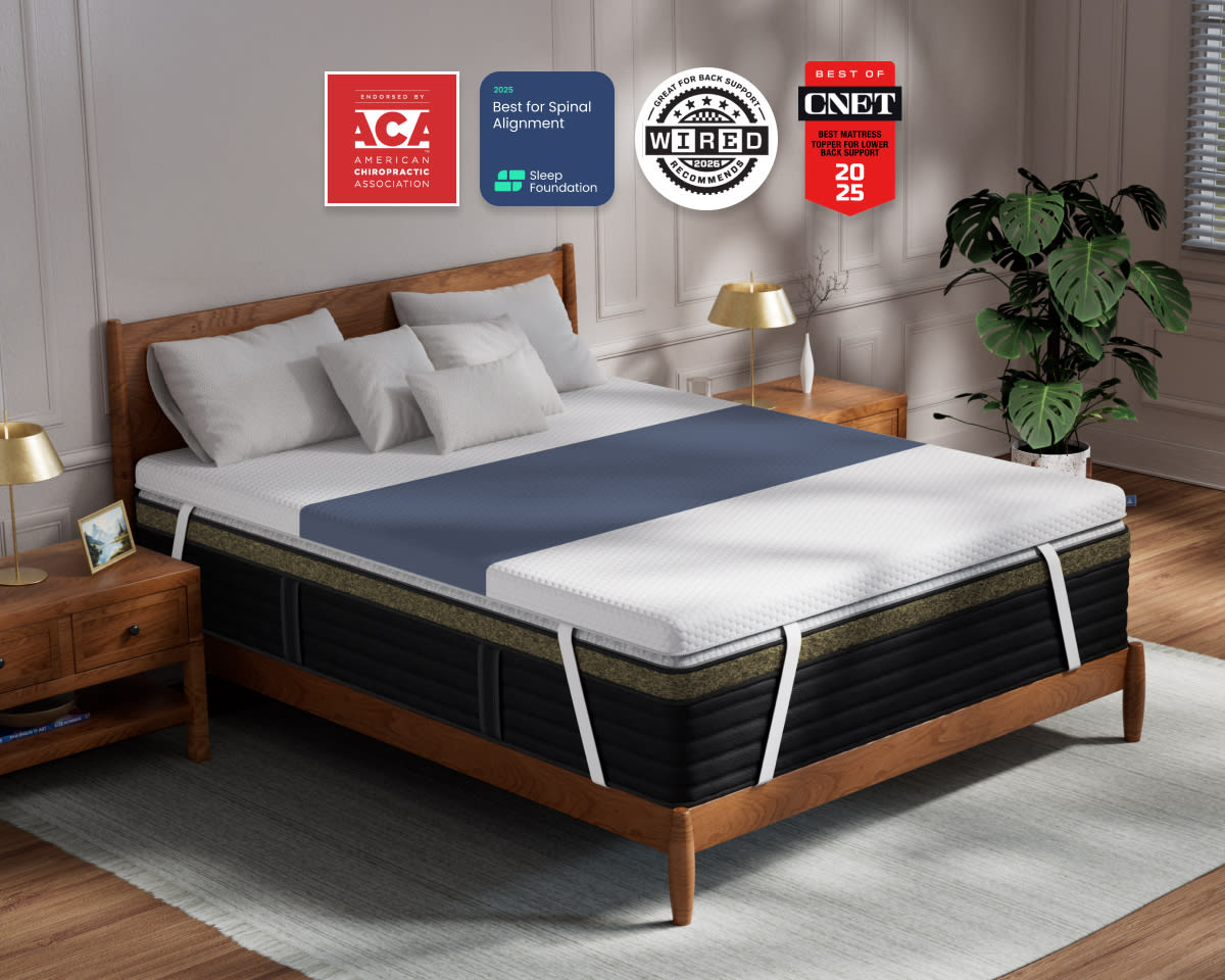 A rendered image of the ErgoAlign Mattress Topper in a bedroom scene with 4 badges highlighting its awards