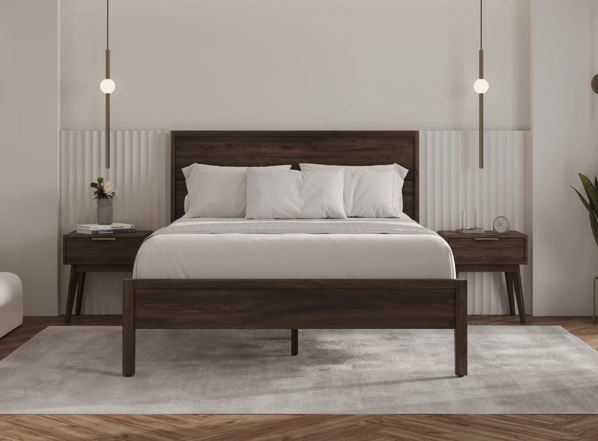 A rendered image of the Ludlow Bed Frame in a bedroom scene