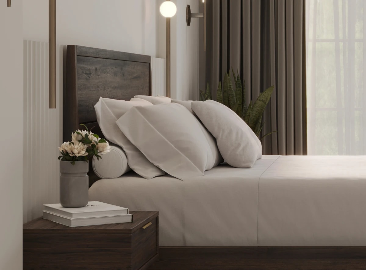 A rendered image of the Ludlow Bed Frame in a bedroom scene