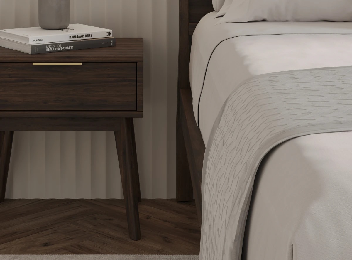 A rendered image of the Ludlow Bed Frame in a bedroom scene