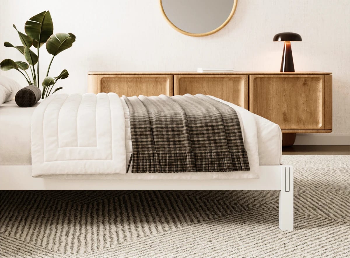 A rendered image of the Madison Bed Frame in a bedroom scene