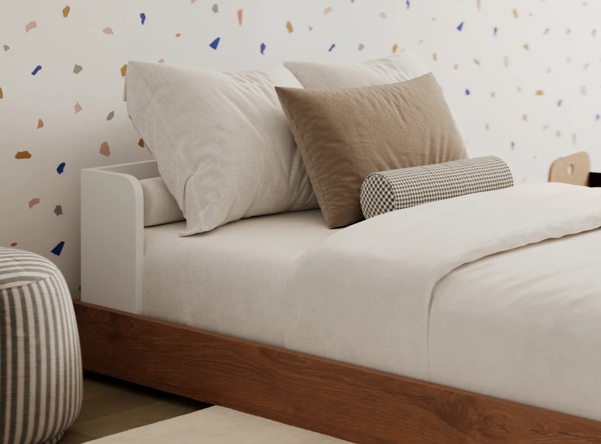 A rendered image of the Bryant Toddler Floor Bed in a kids bedroom scene
