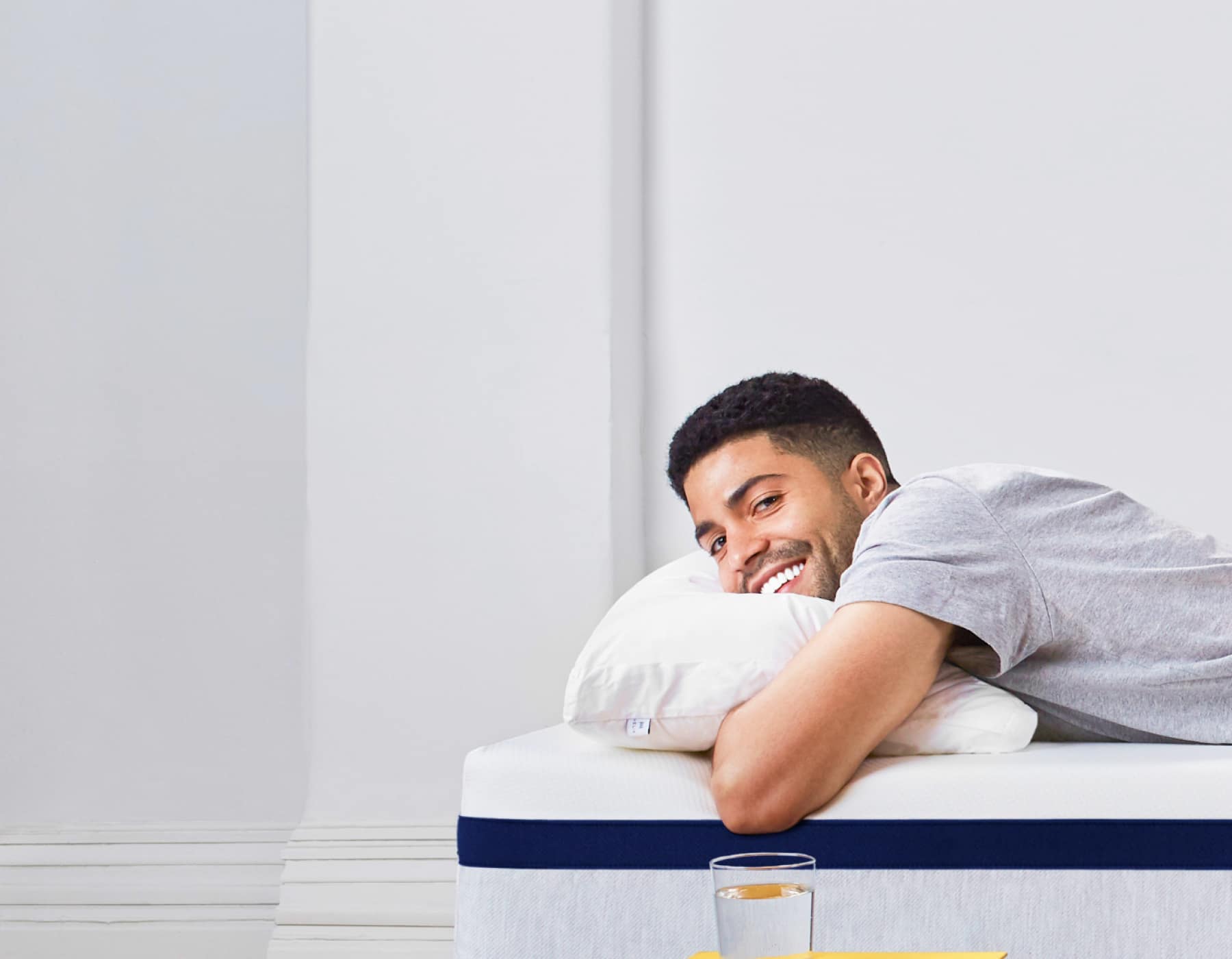 Man Resting on Helix Midnight Mattress