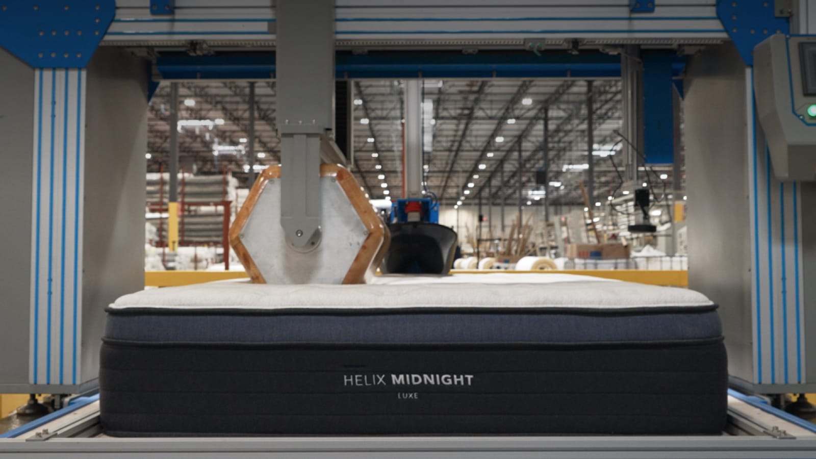 Image of mattress in Phoenix factory getting tested by roller machine