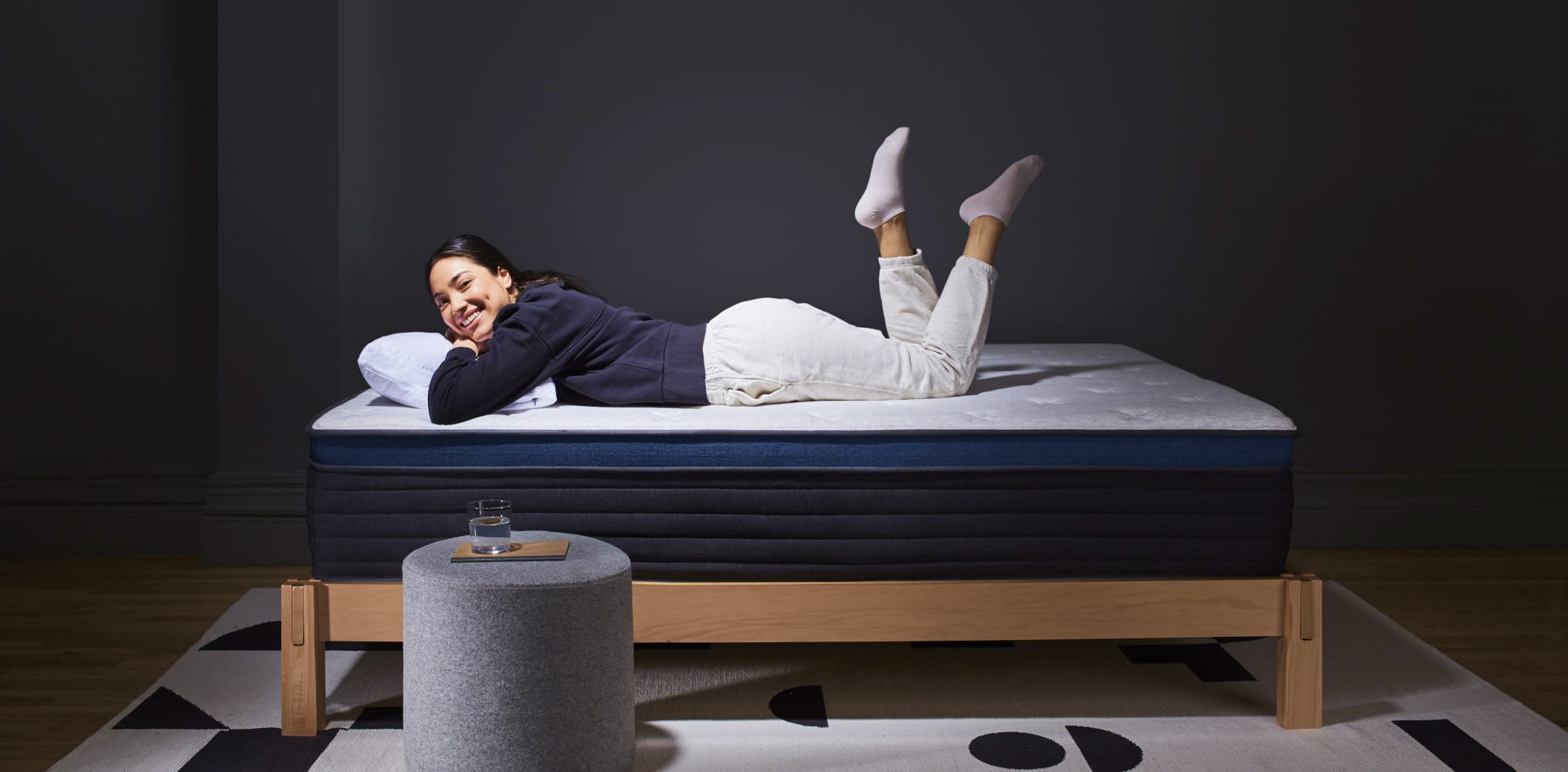 Woman Laying on the Helix Midnight Luxe Mattress