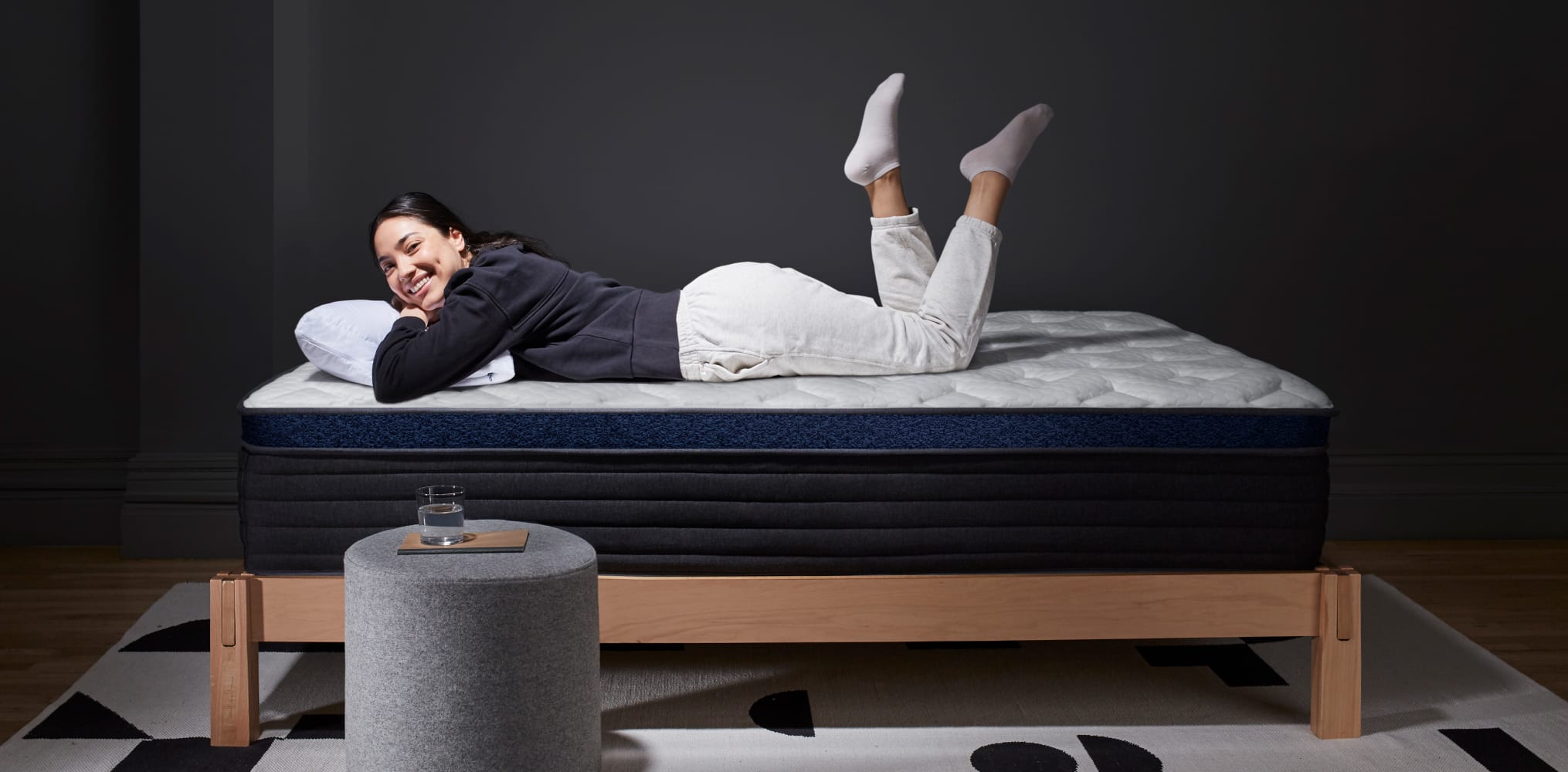 Woman Laying on the Helix Midnight Luxe Mattress