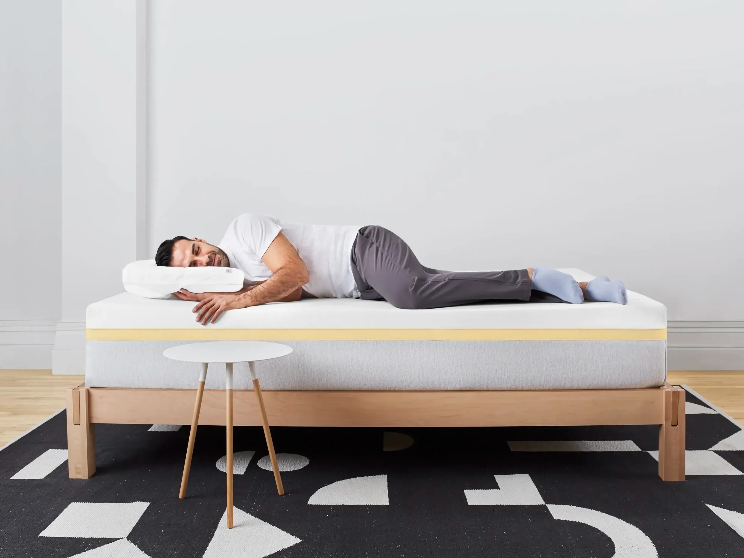 Man Sleeping on our Helix Dawn Standard Mattress