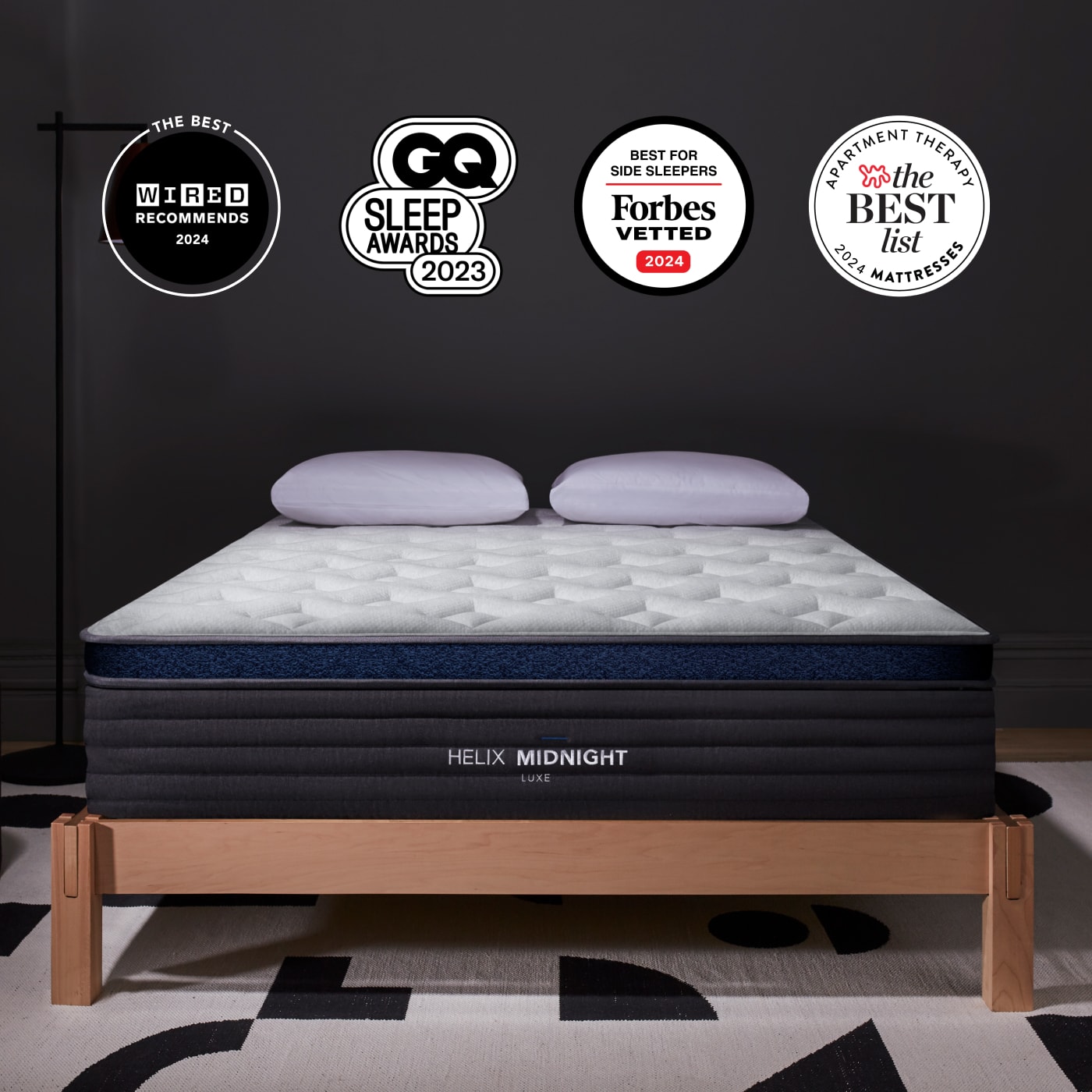 Midnight Luxe Mattress on bed frame with badge accolades overlaid