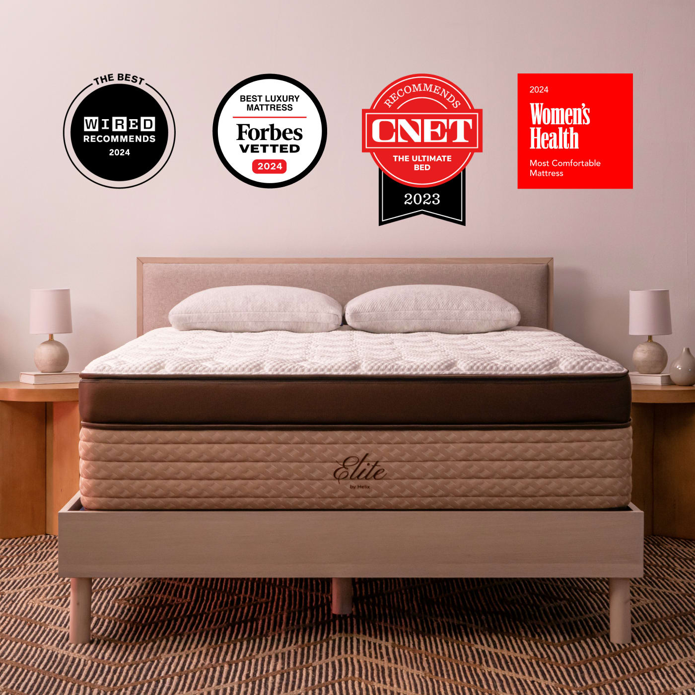 Elite Mattress on bed frame with badge accolades overlaid