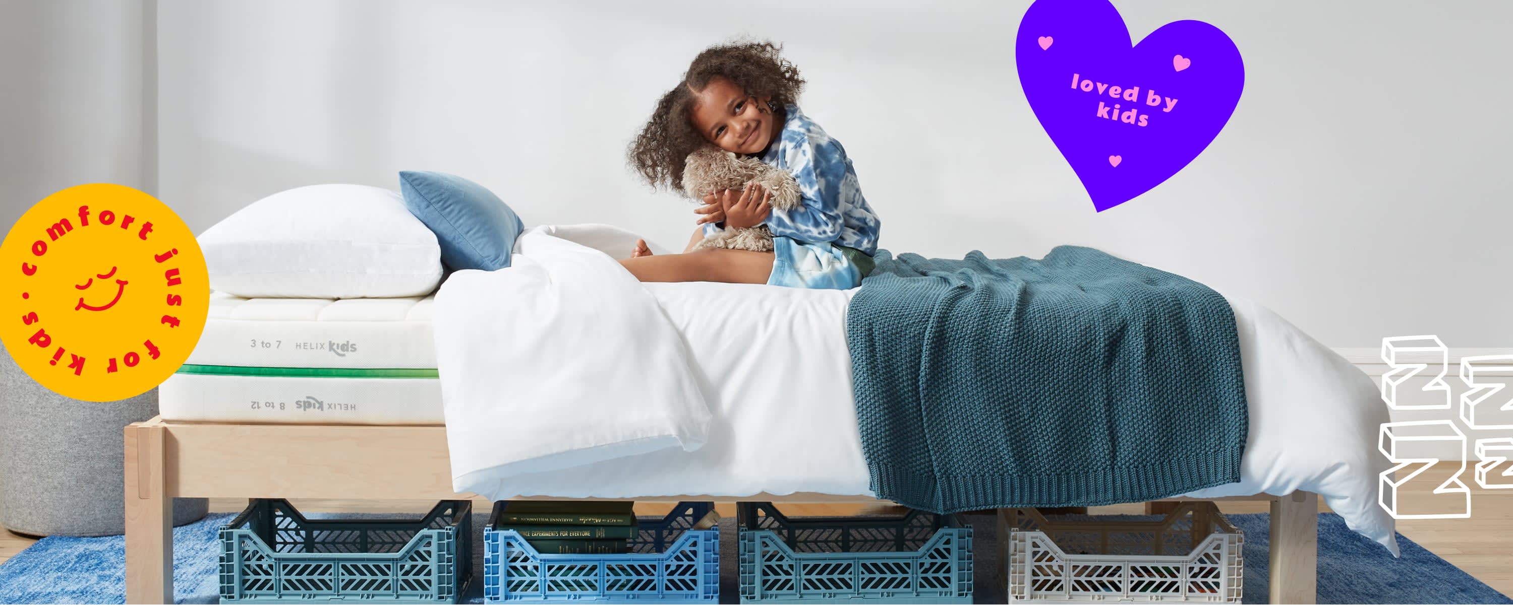Child sitting on a Helix Kids mattress