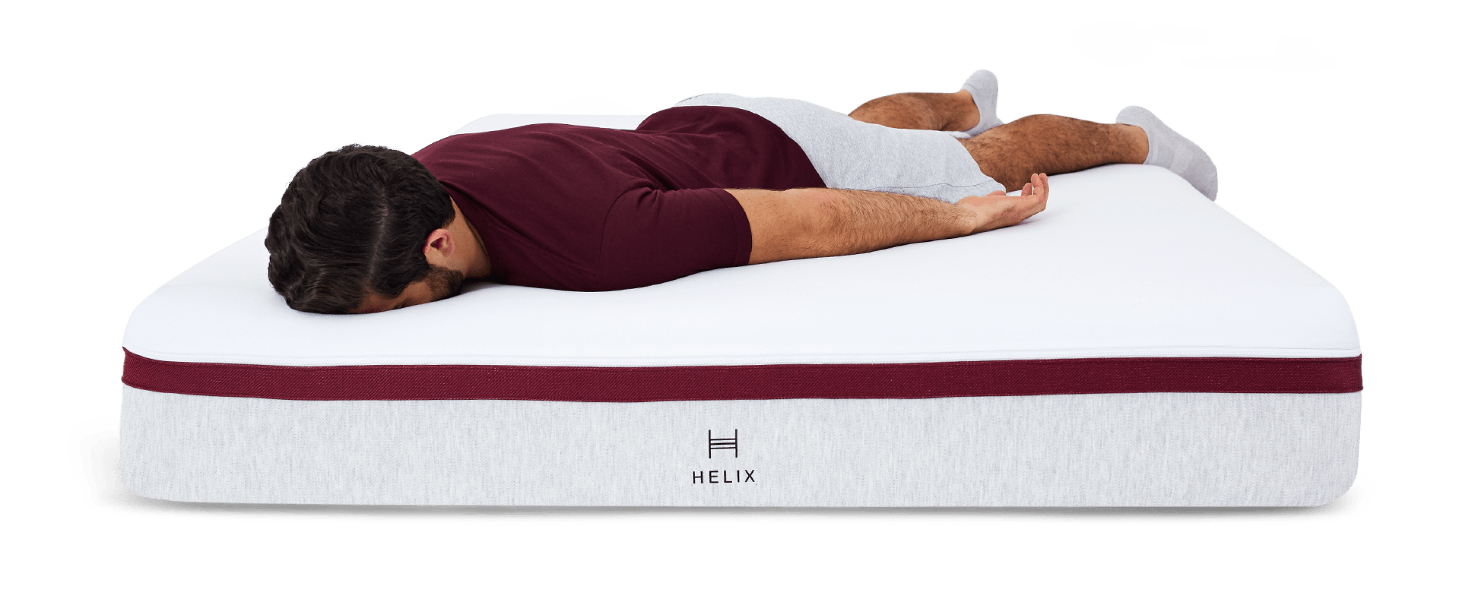 Man laying facedown on Helix Dusk Mattress