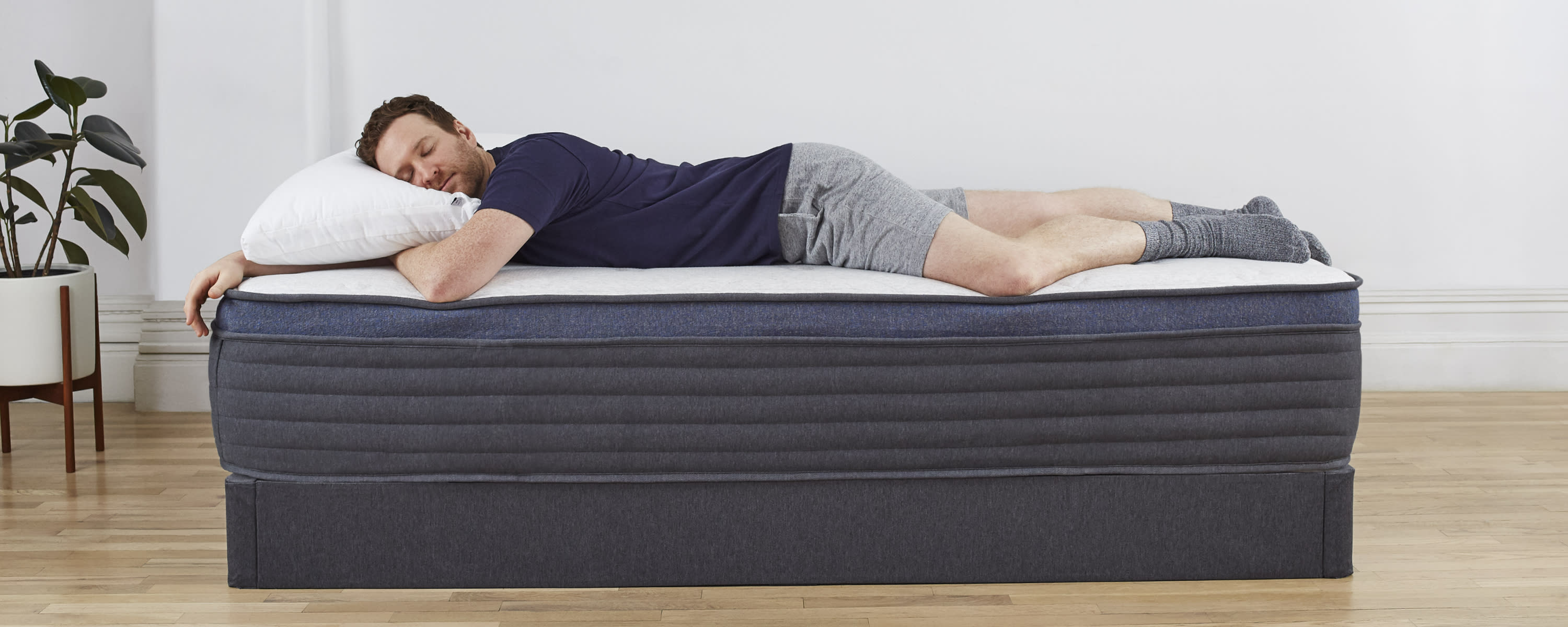 Man-laying-on-Helix-mattress