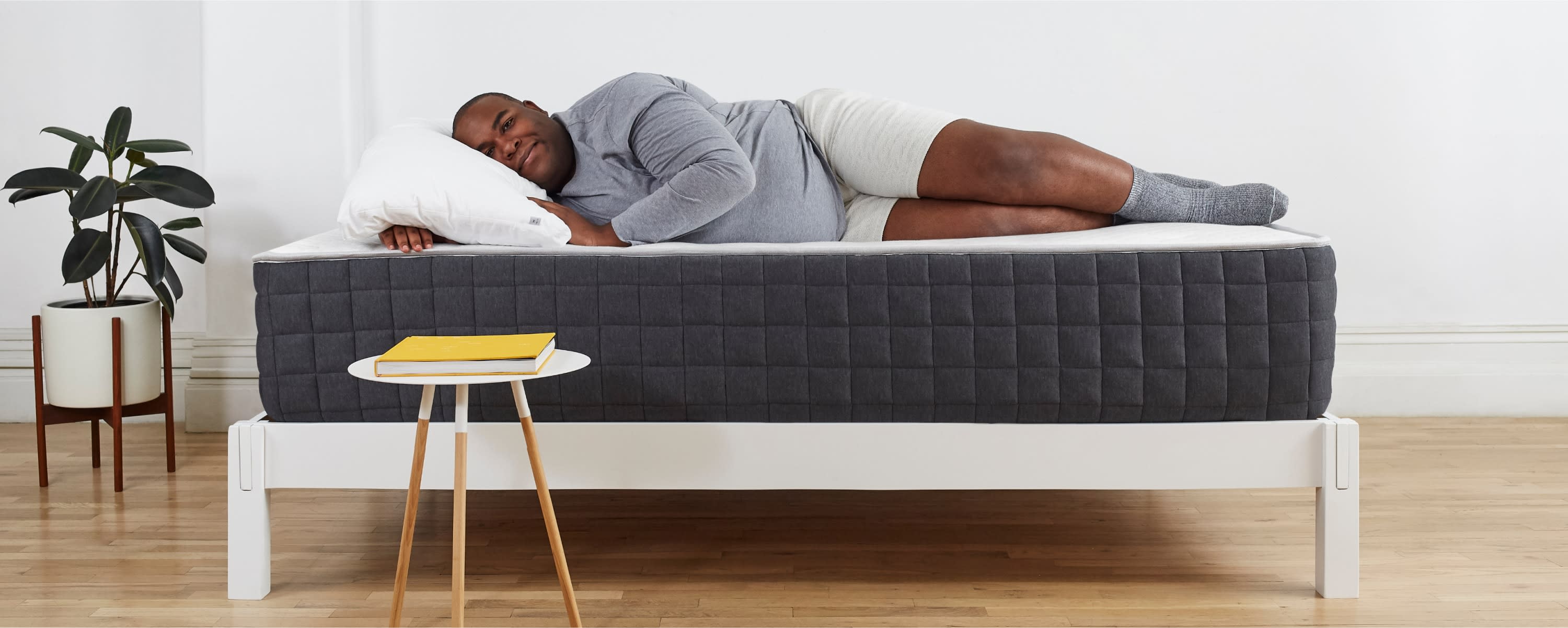 Person sleeping on their side on the Helix Plus mattress