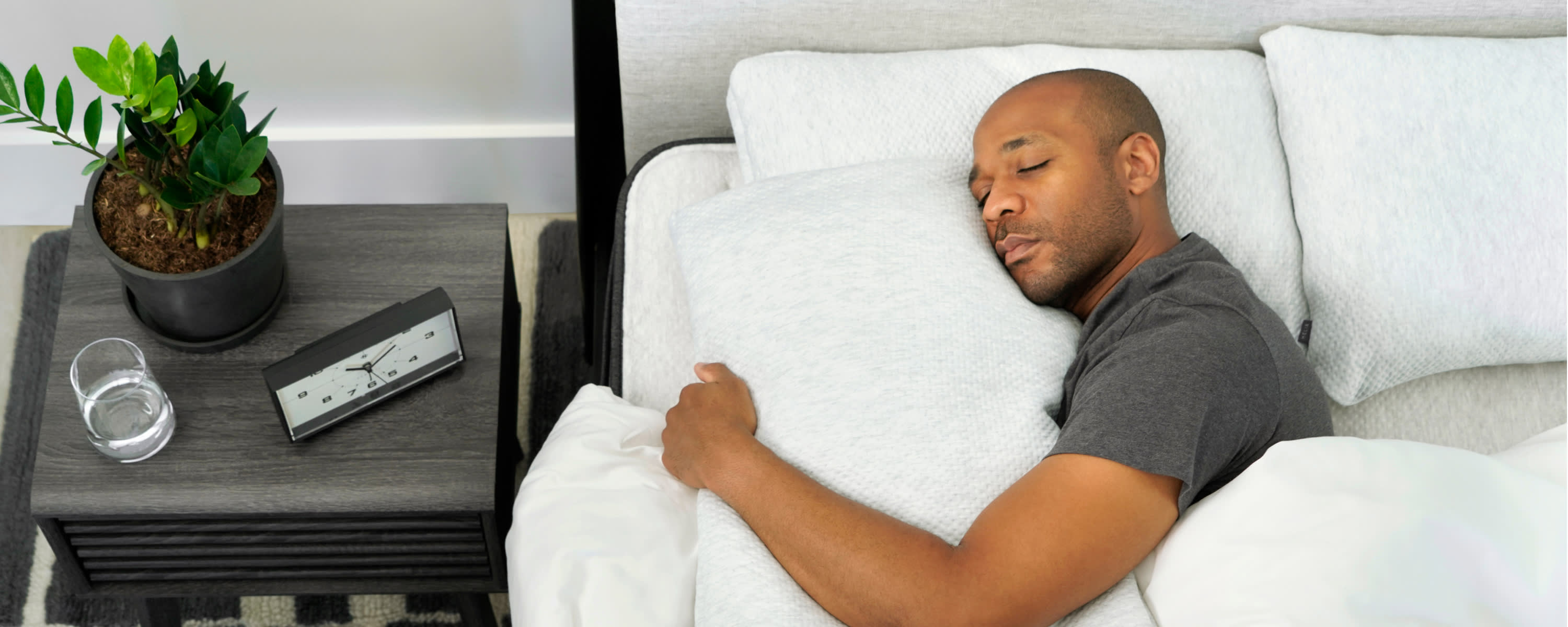 Man sleeping on his side with Helix Side sleeper pillow