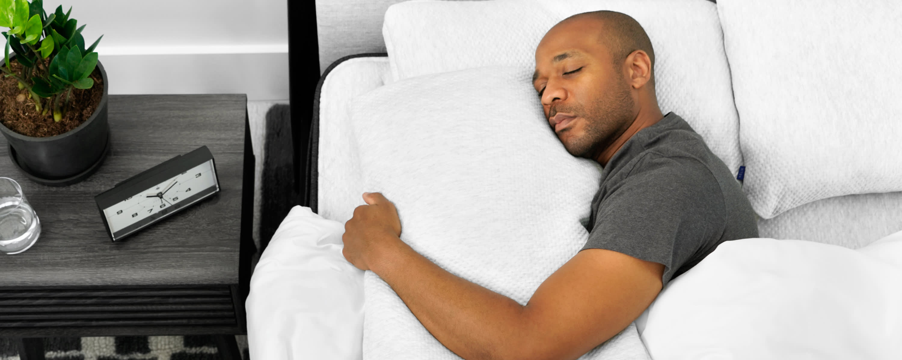 Man sleeping with Helix pillow