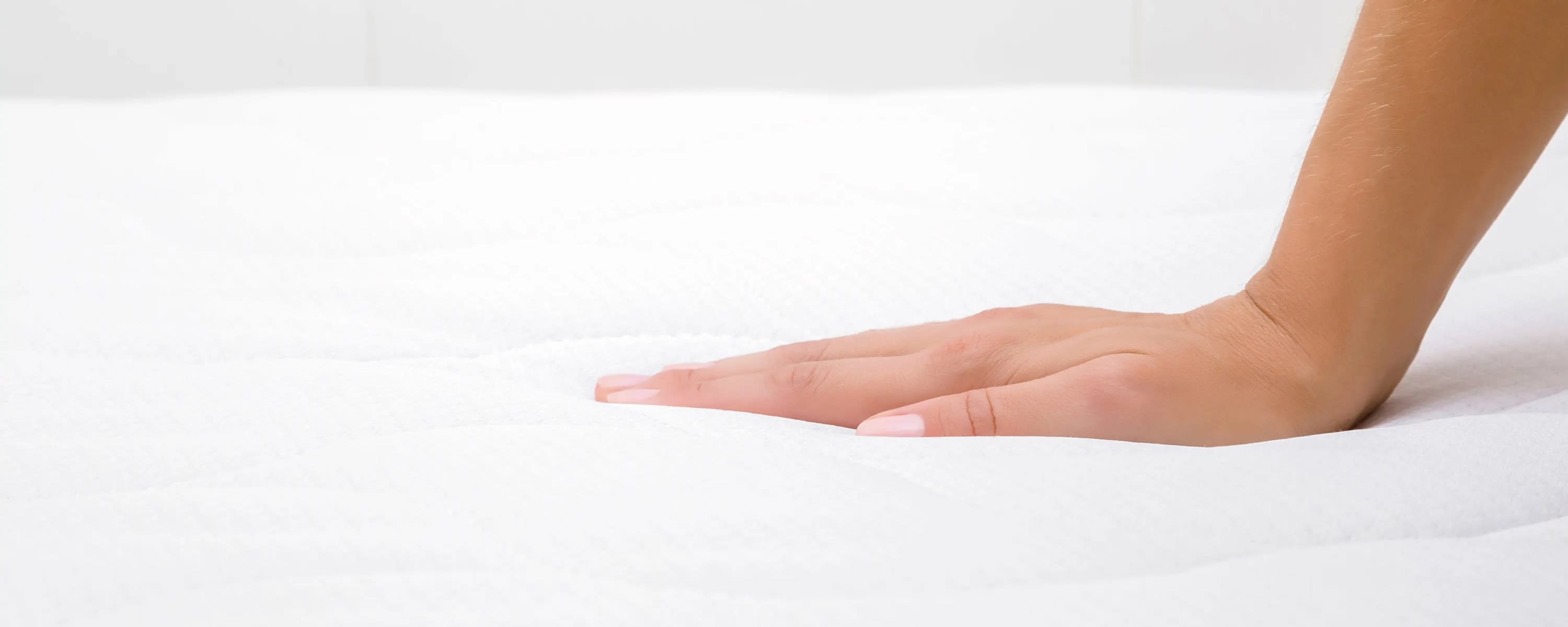 Hand on memory foam mattress