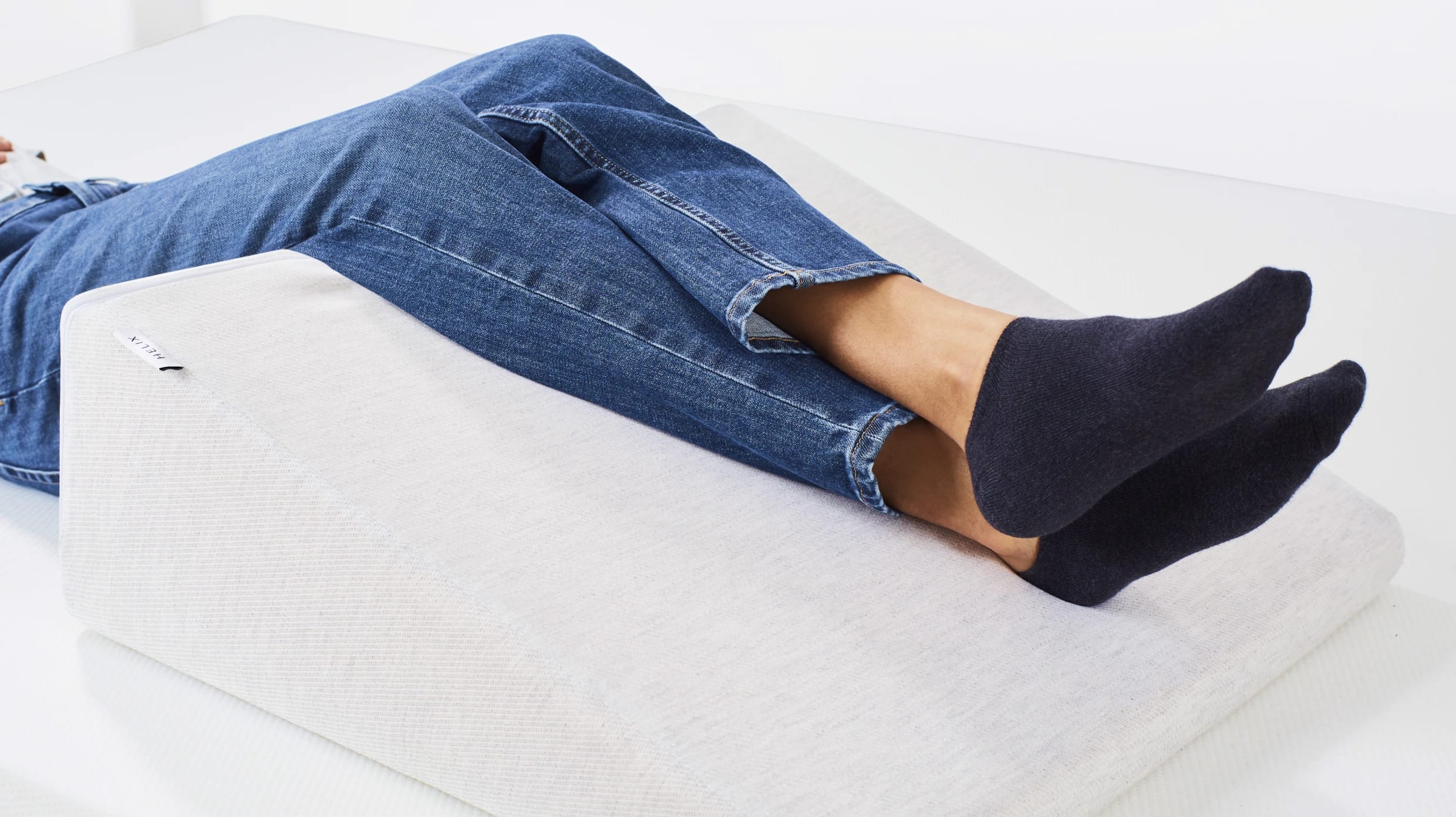 A lifestyle image showing a closeup of the Helix Wedge Pillow