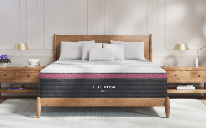 A rendered image of the Helix Dusk Luxe mattress in a bedroom scene