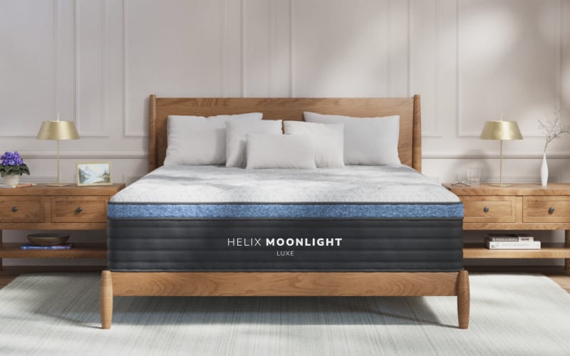 A rendered image of the Helix Moonlight Luxe mattress in a bedroom scene