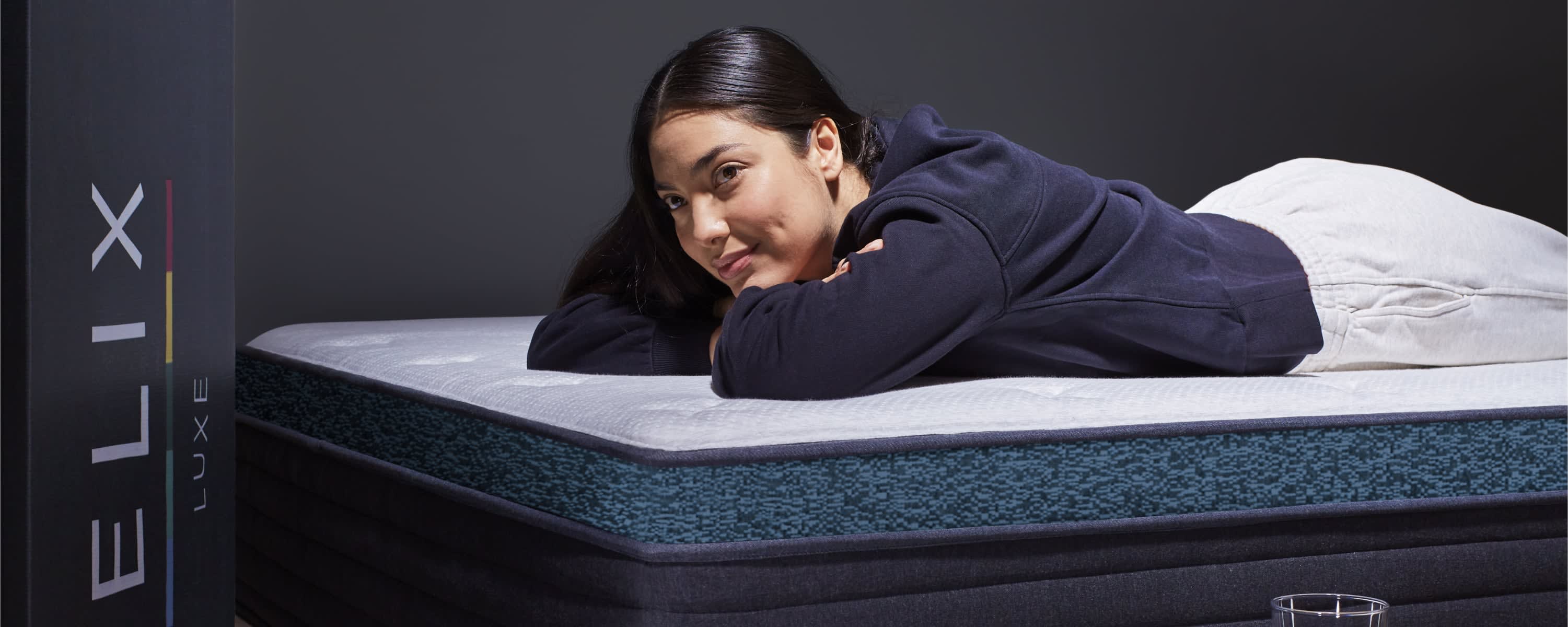 Person laying on Sunset Luxe mattress