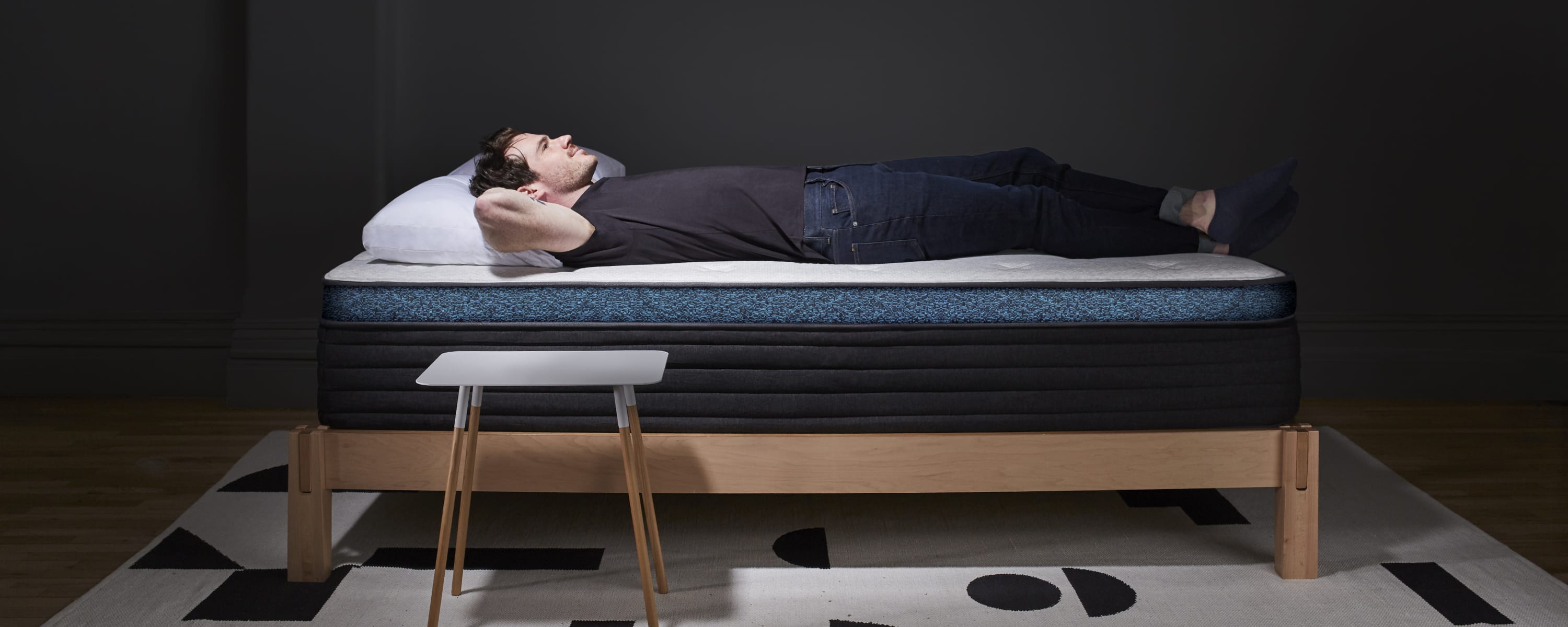 Man laying on Helix Luxe Moonlight mattress