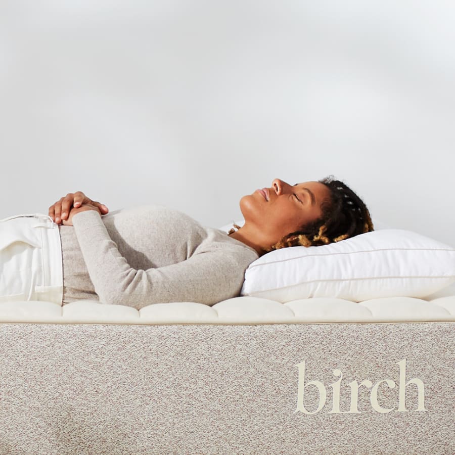 Image of woman sleeping on a birch mattress