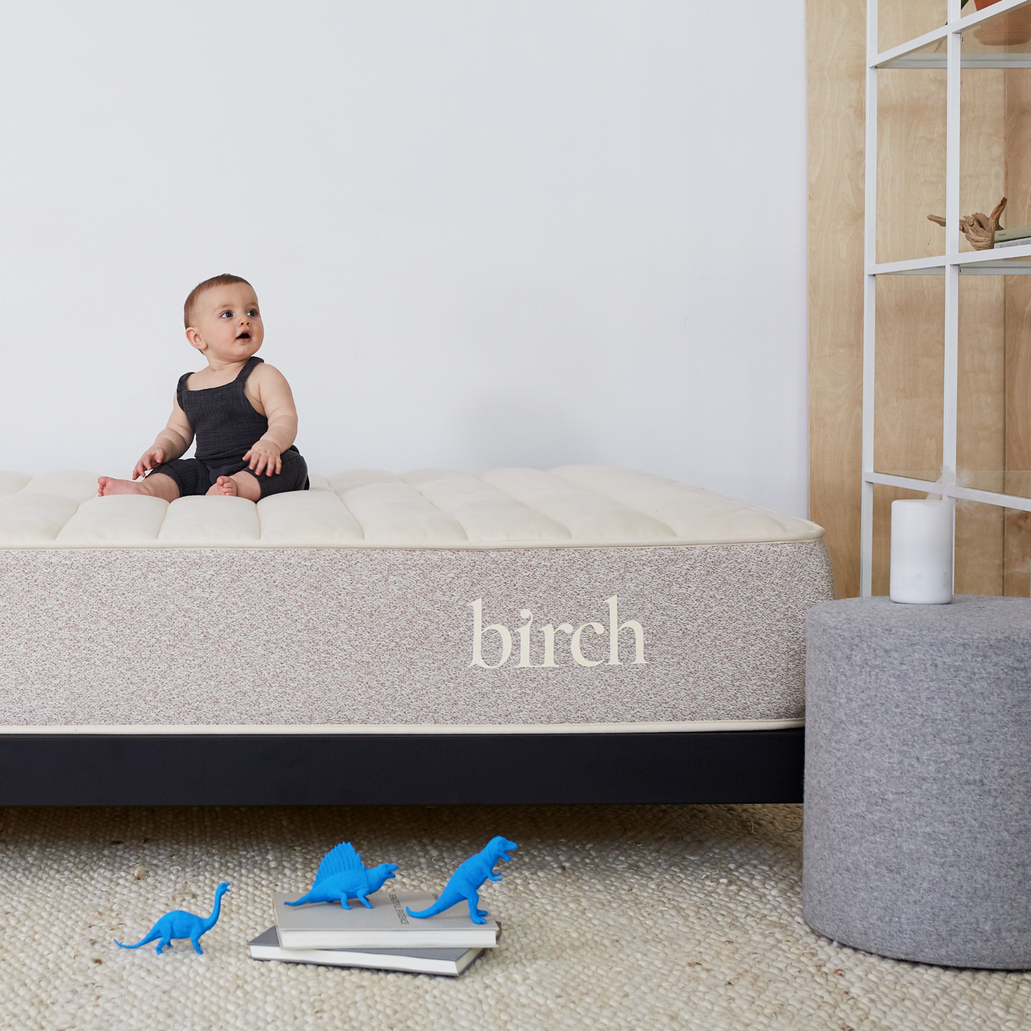 Toddler sitting on a Birch Natural Mattress